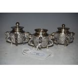 A CHINESE SILVER THREE-PIECE CRUET SET, LATE QING DYNASTY, MARKED 'CHAN KONG'.