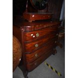 A 19TH CENTURY BREAK FRONT CHEST OF DRAWERS WITH FOUR LONG DRAWERS WITH CIRCULAR BRASS HANDLES ON