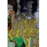 A GROUP OF CRYSTAL INCLUDING THREE DECANTERS, A SET OF SIX CUT CRYSTAL WINE GLASSES AND A