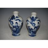 A PAIR OF CHINESE BLUE AND WHITE PORCELAIN VASES, QING DYNASTY, DECORATED WITH FIGURES IN A FENCED