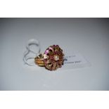 YELLOW METAL RUBY AND SPLIT PEARL CLUSTER RING, STAMPED '9CT', RING SIZE O, GROSS WEIGHT 7.7 GRAMS