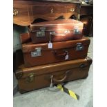 A GROUP OF SEVEN VINTAGE SUITCASES, TO INCLUDE LEATHER AND CANVAS EXAMPLES