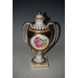 A SPODE REGENCY PATTERN TWIN HANDLED URN AND COVER