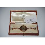 A 9CT GOLD WRISTWATCH IN ORIGINAL LEATHER BOX