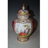 A DRESDEN PORCELAIN PUCE GROUND JAR AND COVER WITH FIGURAL PANEL DETAIL