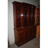 AN EDWARDIAN MAHOGANY AND SATINWOOD BANDED BREAKFRONT BOOKCASE