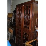 A CHINESE DARKWOOD DISPLAY CABINET / BOOKCASE WITH TWO PAIRS OF SIMULATED ASTRAGAL GLAZED DOORS