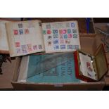 GROUP OF THREE STAMP ALBUMS TOGETHER WITH A TIN OF ASSORTED STAMPS.