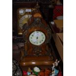 AN EARLY 20TH CENTURY FRENCH ROCOCO STYLE BURR WALNUT MANTEL CLOCK, THE MOVEMENT CONVERTED TO MODERN