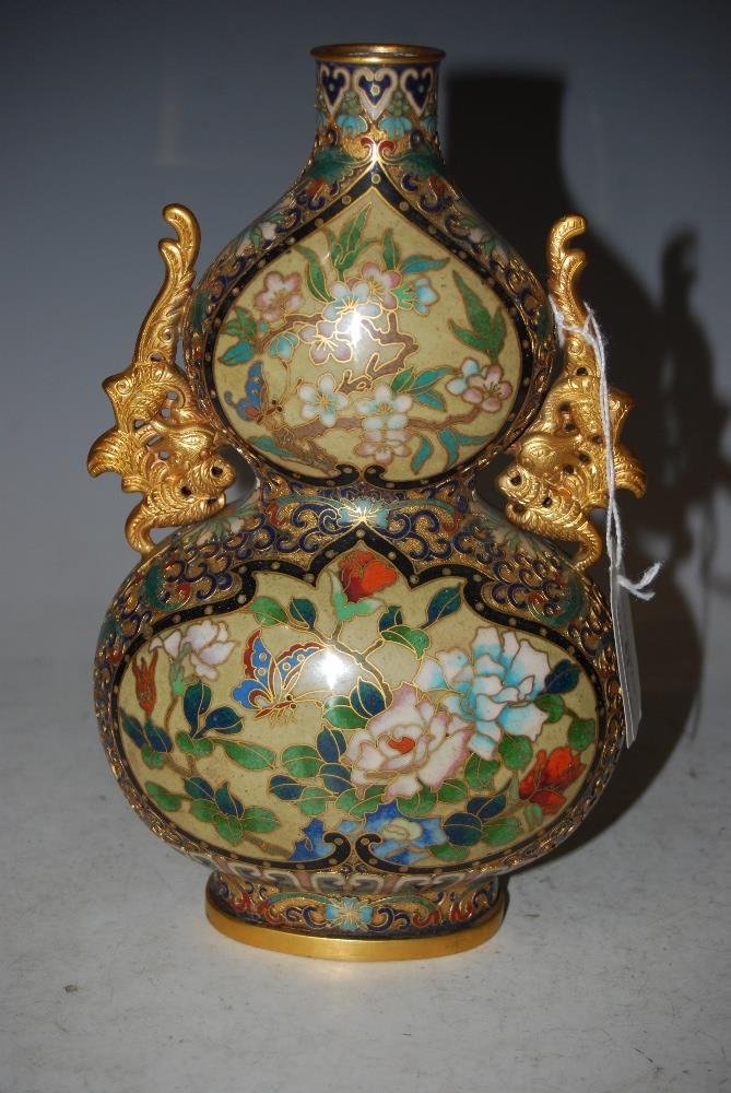 A CHINESE CLOISONNE AND GILT METAL MOUNTED DOUBLE GOURD FORM VASE WITH PHOENIX HANDLES.