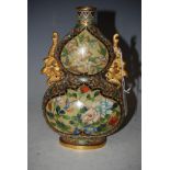 A CHINESE CLOISONNE AND GILT METAL MOUNTED DOUBLE GOURD FORM VASE WITH PHOENIX HANDLES.