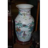 A LARGE CHINESE 20TH CENTURY FAMILLE ROSE VASE DEPICTING DEITIES AND BOYS, TOGETHER WITH WOODEN