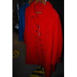 TWO ENGLISH LADIES COATS, INCLUDING A RED WOOL 3/4 LENGTH COAT WITH BLACK BUTTONS, BY HARTNELL, 26