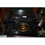 A LATE 19TH / EARLY 20TH CENTURY SCOTTISH BLACK SLATE MANTLE CLOCK OF ARCHITECTURAL FORM WITH TWO