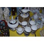 A ROYAL WORCESTER CHARLOTTE PATTERN TEA SET, INCLUDING TEA POT AND SERVING PLATES