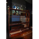 A LATE 19TH / EARLY 20TH CENTURY WALL MOUNTED MAHOGANY SET OF SHELVES, THE SUPPORTS WITH