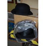 A VINTAGE BLACK SILK TOP HAT, TOGETHER WITH A VINTAGE BOWLER HAT IN HAT BOX