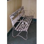 A WHITE PAINTED REGENCY STYLE WROUGHT IRON GARDEN BENCH WITH SLATTED WOODEN SEAT