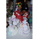 A GROUP OF SEVEN ROYAL DOULTON PORCELAIN LADY FIGURES INCLUDING 'THE BALLOON SELLER', 'TOP O' THE