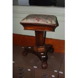 A 19TH CENTURY ROSEWOOD SQUARE REVOLVING PIANO STOOL ON TAPERED HEXAGONAL COLUMN WITH CONCAVE