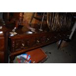 A 19TH CENTURY AND LATER OAK DRESSER BASE WITH THREE DRAWERS WITH SOLID BRASS HANDLES, REMINISCENT