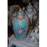 A PAIR OF MEISSEN STYLE DRESDEN PORCELAIN LIDDED URNS, 20TH CENTURY, WITH FLORAL PANELS IN TURQUOISE