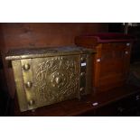 AN ARTS AND CRAFTS EMBOSSED BRASS FUEL BIN, THE COVER WITH GALLEON DETAIL TOGETHER WITH AN OAK ART