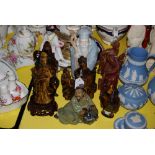 FOUR MODERN CHINESE CARVED TIGERS EYE FIGURES, INCLUDING TWO FIGURES OF GUANYIN, A FIGURE OF A