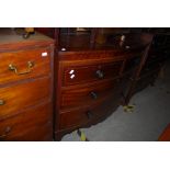 A 19TH CENTURY MAHOGANY AND BOXWOOD LINED BOWFRONT CHEST OF TWO SHORT OVER TWO LONG DRAWERS ON