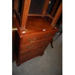 A GEORGE III STYLE REPRODUCTION WALNUT CHEST OF FOUR DRAWERS