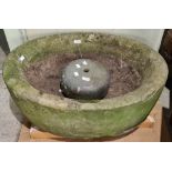 A late 19th / early 20th century carved sandstone garden planter, of oval form with an inset bowl,
