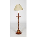 Early 20th century standard lamp, with circular turned tray over a barley twist simulated rosewood