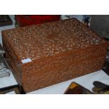 Early 20th century Indian carved teak work box, the lid and interior of the lid carved with