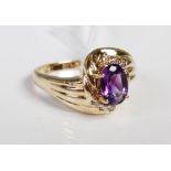 Yellow metal amethyst and diamond set cocktail ring.