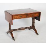 A 20th century reproduction walnut Sutherland table, the cross-banded rectangular top with two short