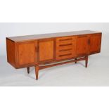 A Mid-20th century G Plan teak modernist dining suite, circa 1970s, comprising a sideboard