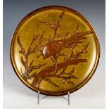 Japanese bronze dish, Meiji Period, decorated in relief with bird perching on prunus blossom branch,
