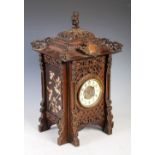 Late 19th century Aesthetic Movement mantel clock in the form of a pagoda, the circular dial with