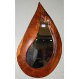 A modern yew framed mirror, of teardrop form, 53cm long.