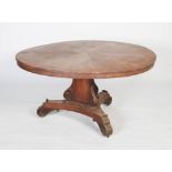 A 19th century mahogany tilt top breakfast table, the round flame mahogany fan veneered tilt top