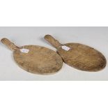 Two 20th century oak Mouseman serving boards, of oval form with a handle featuring characteristic