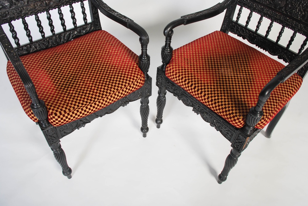 A pair of matched Anglo-Indian ebony armchairs, mid 19th century, possibly Ceylonese, the frames - Image 7 of 10