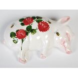 A Wemyss Ware Exon sleeping piglet, decorated with clovers and bumblebees, impressed and painted