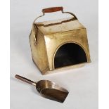 An Art Deco period planished brass fuel bin, of hexagonal form with swing handle featuring a
