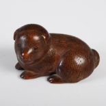 A Japanese wood netsuke of a bear cub, Meiji Period, with finely carved details, 4cm wide x 2.2cm