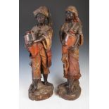 Pair of Goldscheider type cold painted terracotta figures of water carriers, late 19th/ early 20th