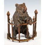 Late 19th/ early 20th century bronze inkwell in the form of a bear, modelled standing leaning on a