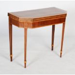 An early 20th century mahogany and satinwood fold out card table, the folding rectangular top with
