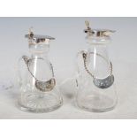 Near pair of Birmingham silver mounted clear glass whisky noggins, both with silver spirits labels
