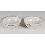 A pair of 19th century Chinese famille rose punch bowls, typically decorated with an floral border